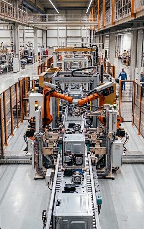 Industrial manufacturing line with robotic arms